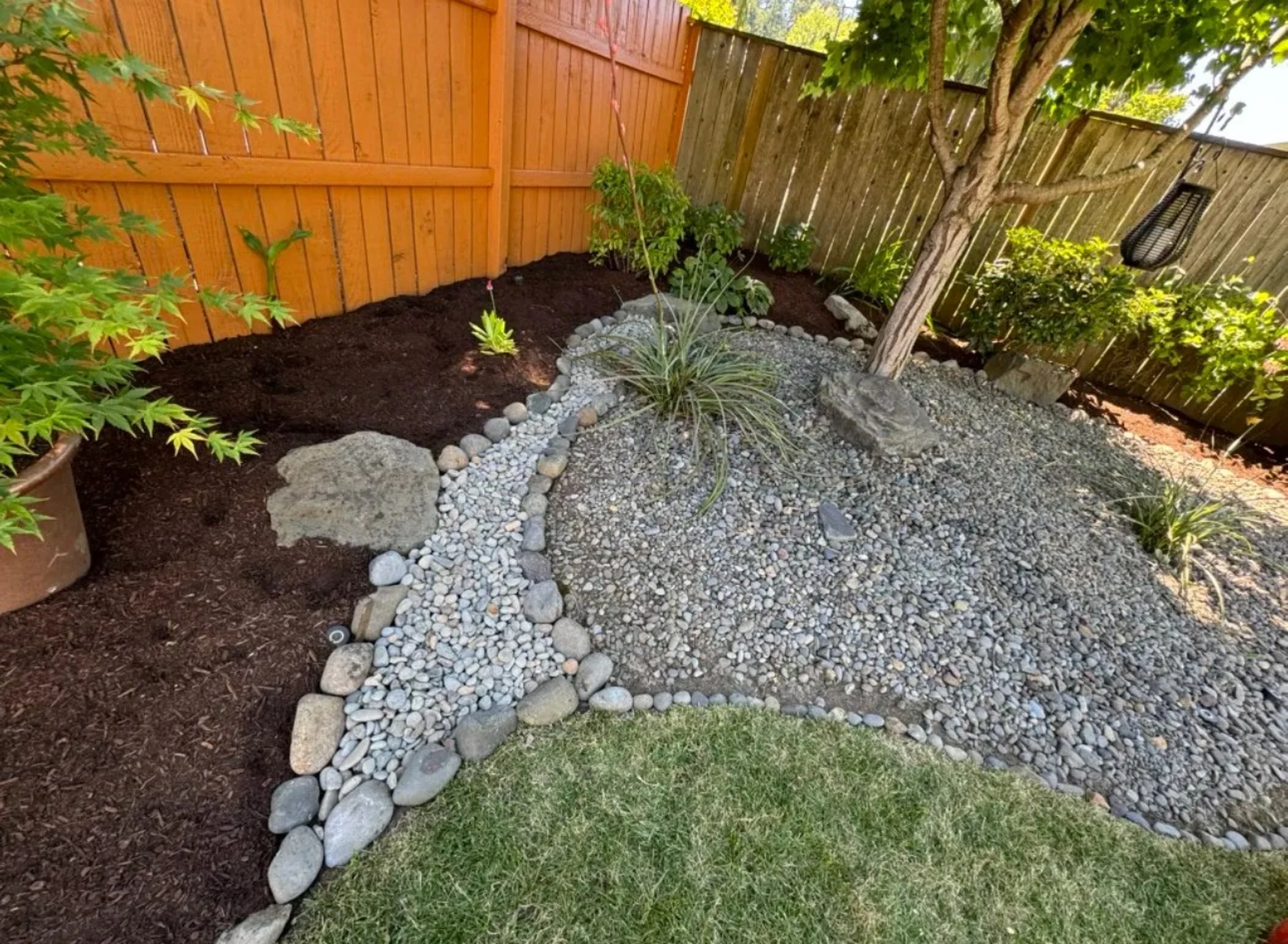 Completed rock garden and landscape project by Mendoza Lawn Care